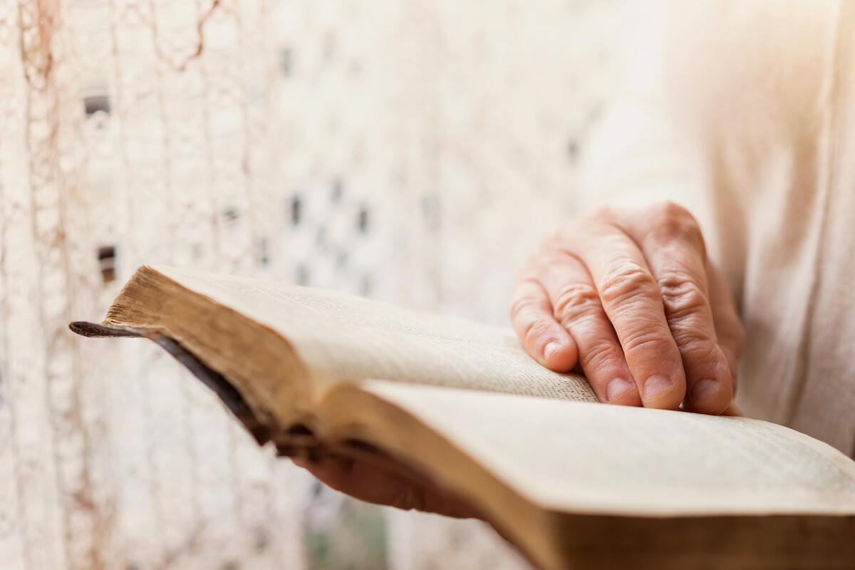 Unrecognizable woman holding a bible in her hands Woman with bible